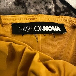 Fashion Nova Mustard Yellow mini dress with elegant design at top